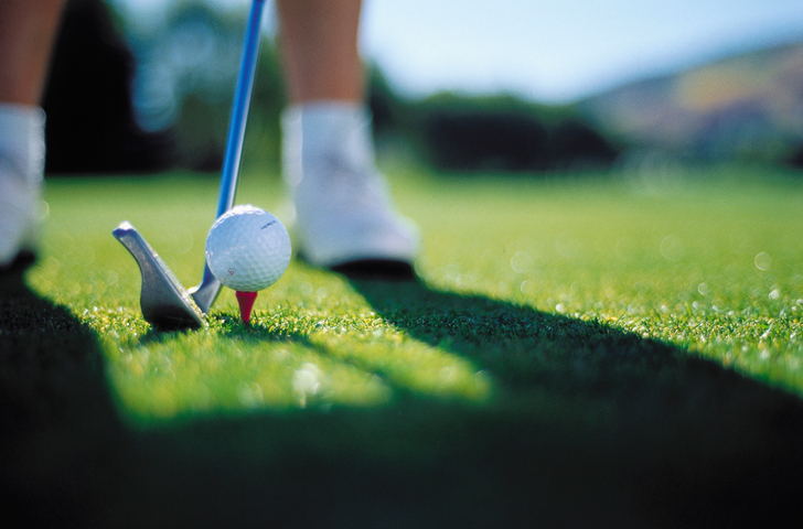 Golfer Teeing Off