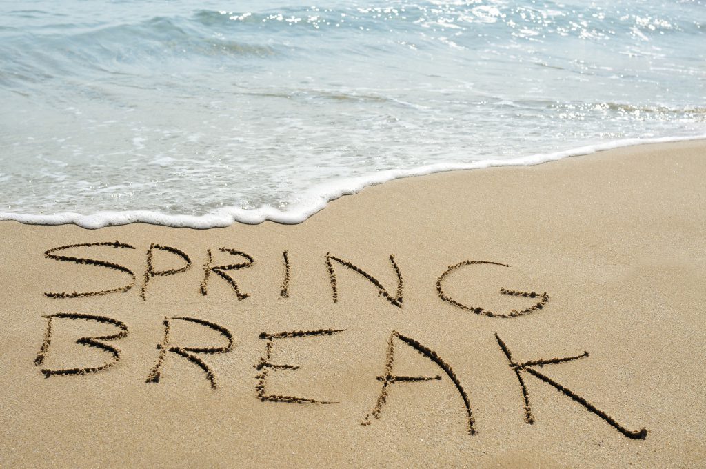 spring break written in sand